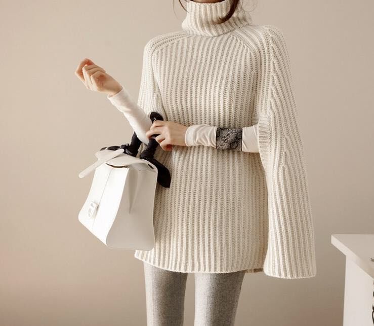 Damen Strickpullover mit hohem Kragen und asymmetrischem Schnitt