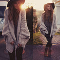 Damen Grobstrickjacke im lässigen Oversized-Stil mit tiefem Schnitt und voluminösen Ärmeln