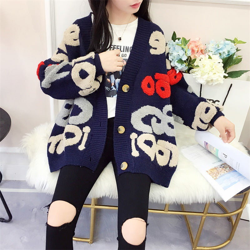 Damen Strickjacke mit buntem grafischen Design und gemütlichen Knöpfen