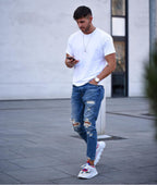 Herren modische Slim Fit Jeans mit angesagten Rissen und Verjüngung R&B