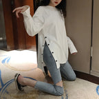 Damen Langarmshirt mit asymmetrischem Schnitt und dekorativen Knöpfen