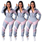 Damen sportlicher Jumpsuit mit modischen Farbblockdetails und hohem Kragen