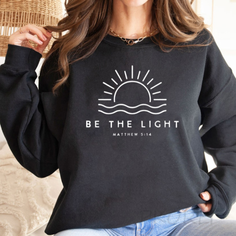 Pullover „Be The Light“.