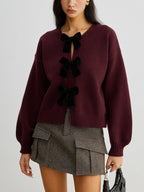 R&B | Strickcardigan mit Samtschleifen Wollmischung Feminin und Modern