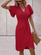 elegante wikkeljurk met korte mouwen