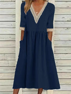 Kleid mit Spitzenverzierung und halben Ärmeln