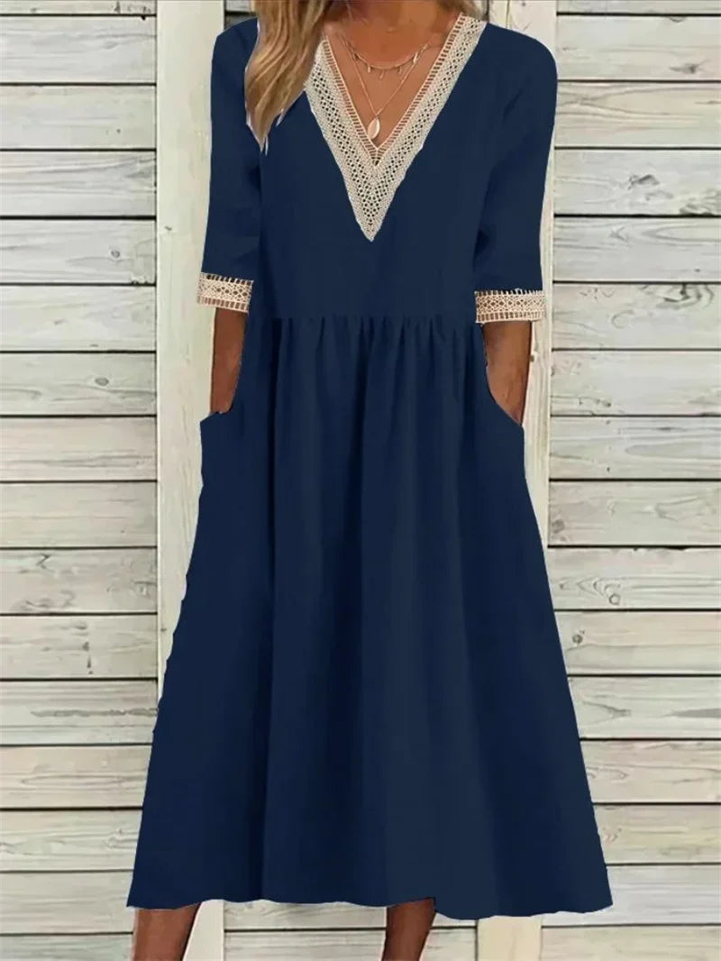 Kleid mit Spitzenverzierung und halben Ärmeln