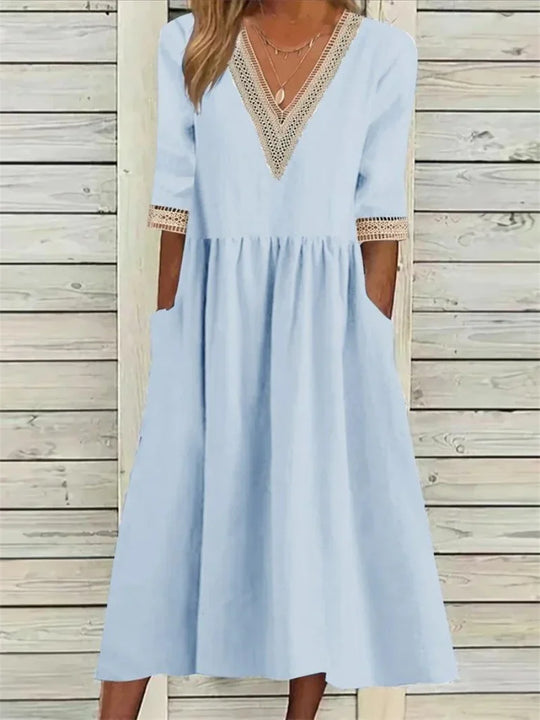 Kleid mit Spitzenverzierung und halben Ärmeln