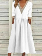 Kleid mit Spitzenverzierung und halben Ärmeln