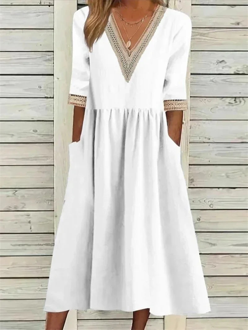 Kleid mit Spitzenverzierung und halben Ärmeln