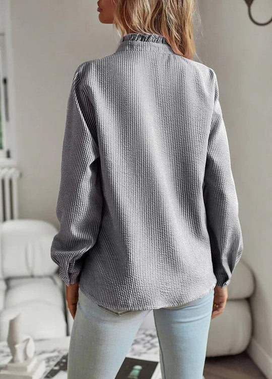 Modische Bluse mit langen Ärmeln und Streifenmuster