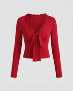 Romantisches Langarmshirt mit V-Ausschnitt und verspielter Schleife