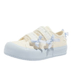 Damen Sneakers mit verspieltem Riemenverschluss und dekorativen Schleifen