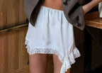 Damen Elegante Satin-Shorts mit Spitzenbordüre und asymmetrischem Saum R&B