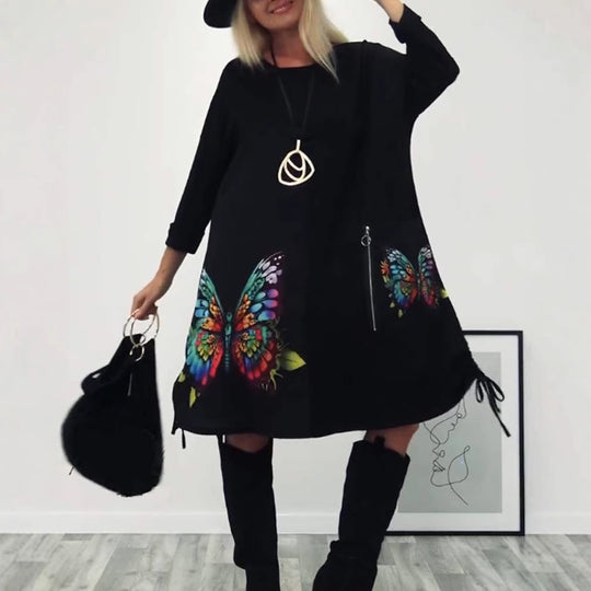 Damen Kleid mit buntem Schmetterlingsdruck und seitlichen Taschen Heidi-Mode