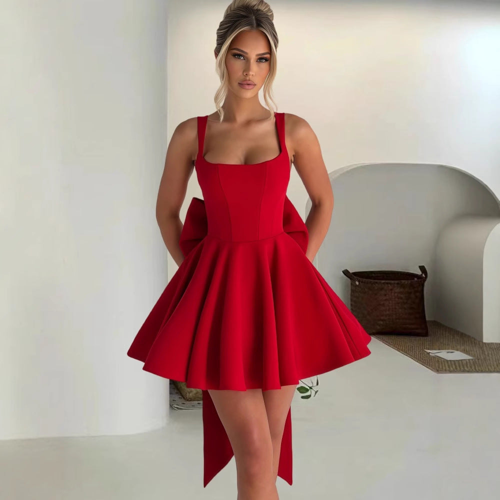 Damen Cocktailkleid mit oversized Schleifen-Design und fließendem Rock EB