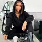 Damen Sportlicher Jumpsuit mit durchgehendem Reißverschluss und Kapuze
