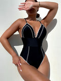 Damen Einteiler Badeanzug mit figurformendem Schnitt und trendigen Kontrastdetails