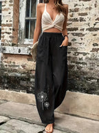 Damen luftige Palazzo-Hose mit praktischen Taschen und kunstvollem Dandelion-Design