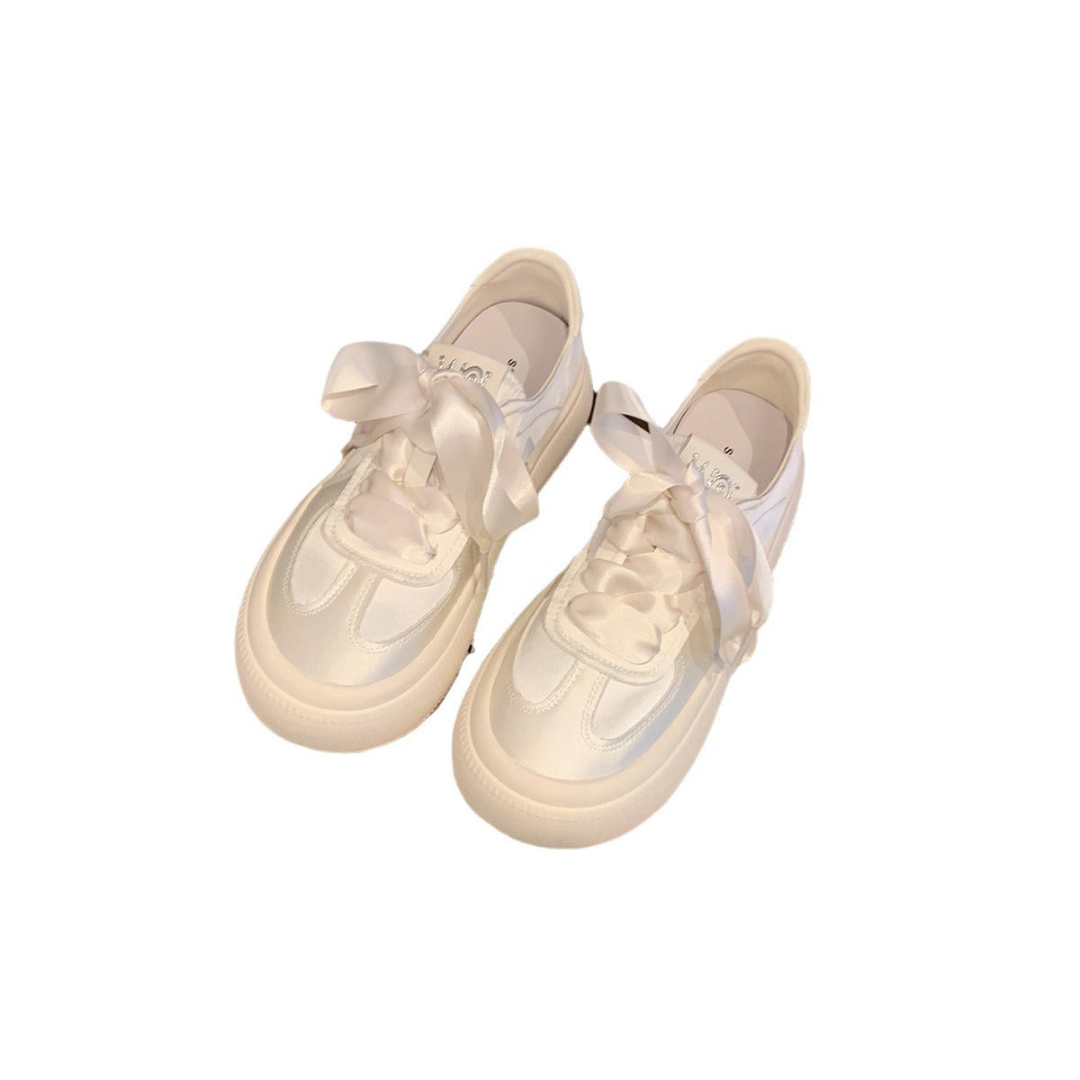 Damen Sneaker mit dekorativen Schleifen und hochwertiger Oberflächenstruktur