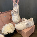 Damen Sneaker mit dekorativen Schleifen und hochwertiger Oberflächenstruktur