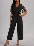 Damen Eleganter Jumpsuit mit transparenten Ärmel-Details und Taillengürtel R&B
