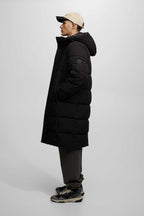 Damen gesteppte Wintermantel mit Kapuze und praktischen Taschen Hedi-Mode