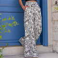 Damen Weit geschnittene Palazzo-Hose mit floralem Muster und elastischem Bund R&B