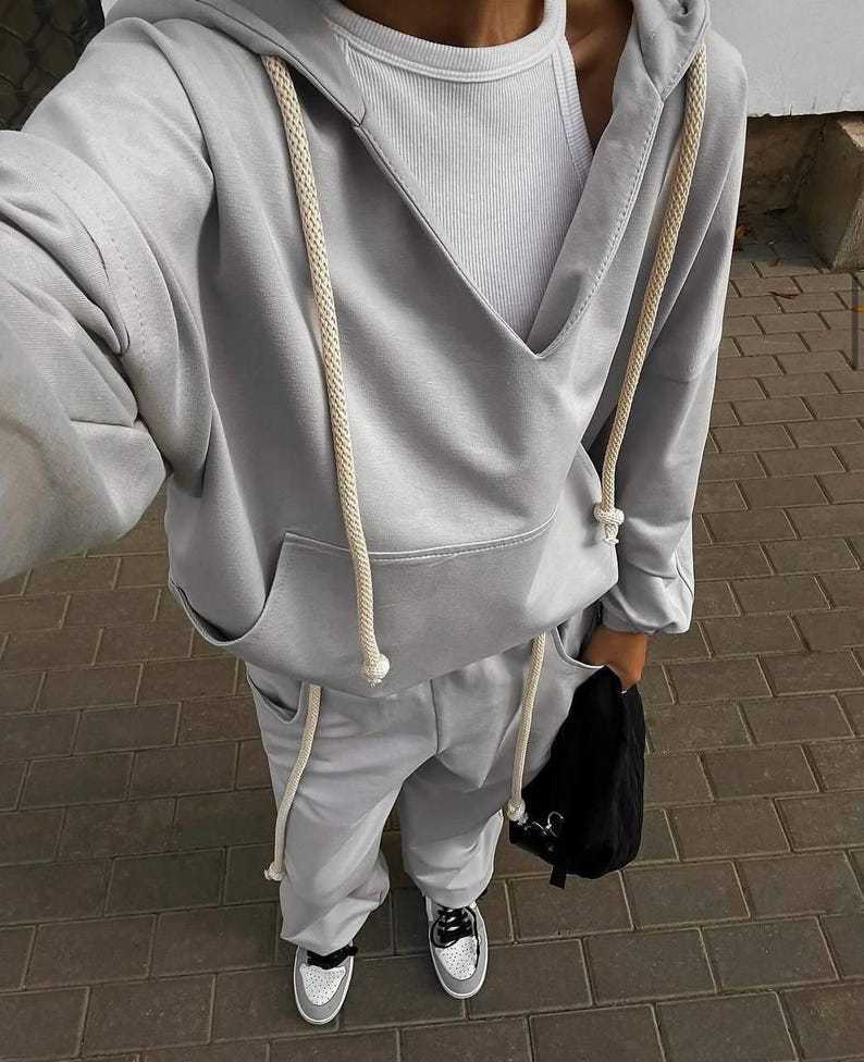 Damen lässiges Sport-Set mit Kapuze und praktischen Taschen R&B