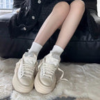 Damen Sneakers mit glitzernden Applikationen und hochgezogenem Plateau