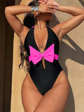 Damen Badeanzug mit raffiniertem Cut-Out und feminine Schleifenakzenten