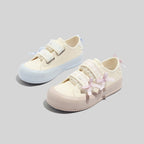 Damen Sneakers mit verspieltem Riemenverschluss und dekorativen Schleifen