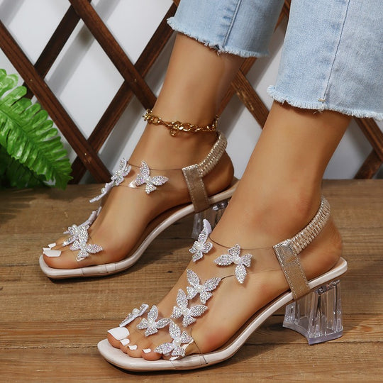 Damen Glamouröse Sandalen mit funkelnden Schmetterlingsdetails und transparentem Blockabsatz R&B