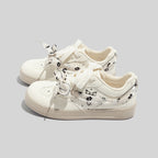 Damen Sneakers mit floralem Druck und innovativem Schnürsystem