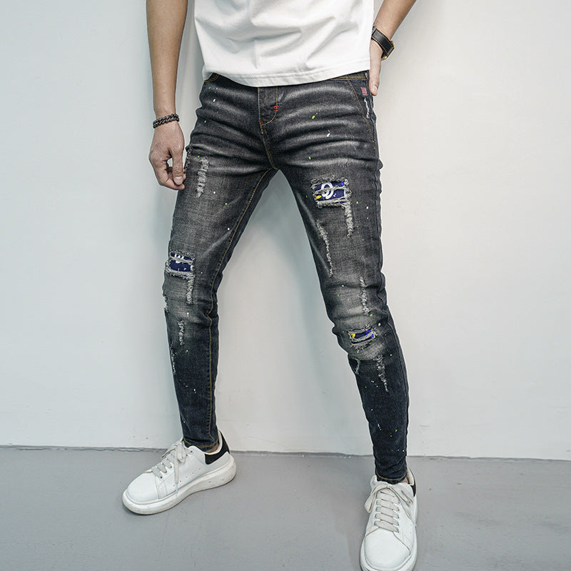 Herren Skinny Fit Jeans im kreativen Rissdesign und bunten Farbsklecks R&B