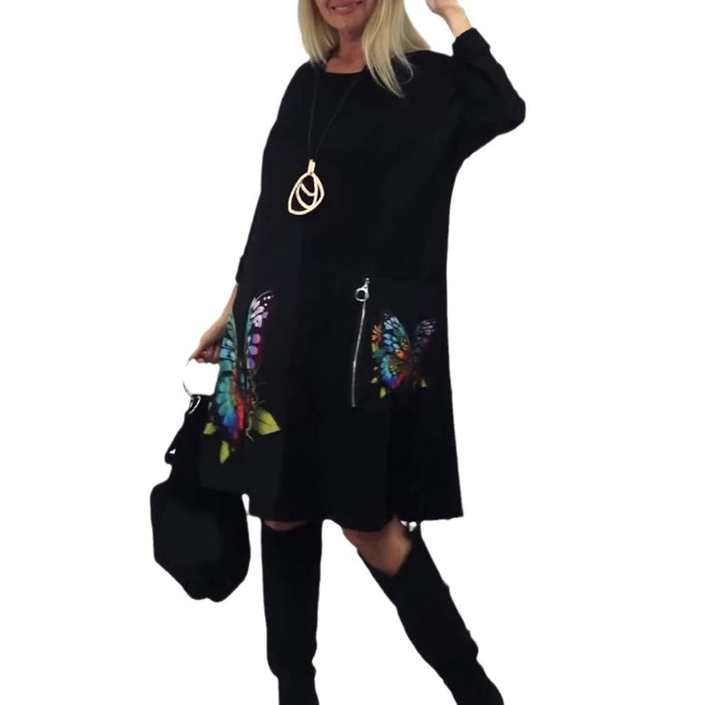 Damen Kleid mit buntem Schmetterlingsdruck und seitlichen Taschen Heidi-Mode
