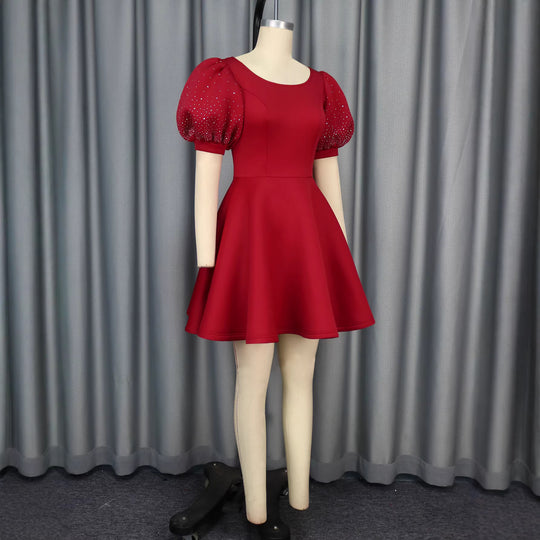 Damen Cocktailkleid mit voluminösen Puffärmeln und schimmernden Akzenten R&B