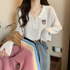 Damen Cropped Pullover mit einem Knopfverschluss und Einhorn-Emblem