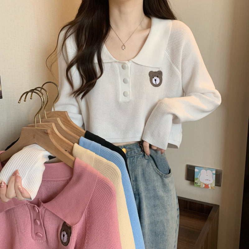 Damen Cropped Pullover mit einem Knopfverschluss und Einhorn-Emblem