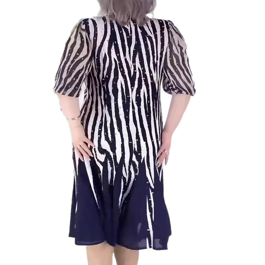 Damen Midikleid mit voluminösen Puffärmeln und dynamischem Streifenmuster Heidi-Mode