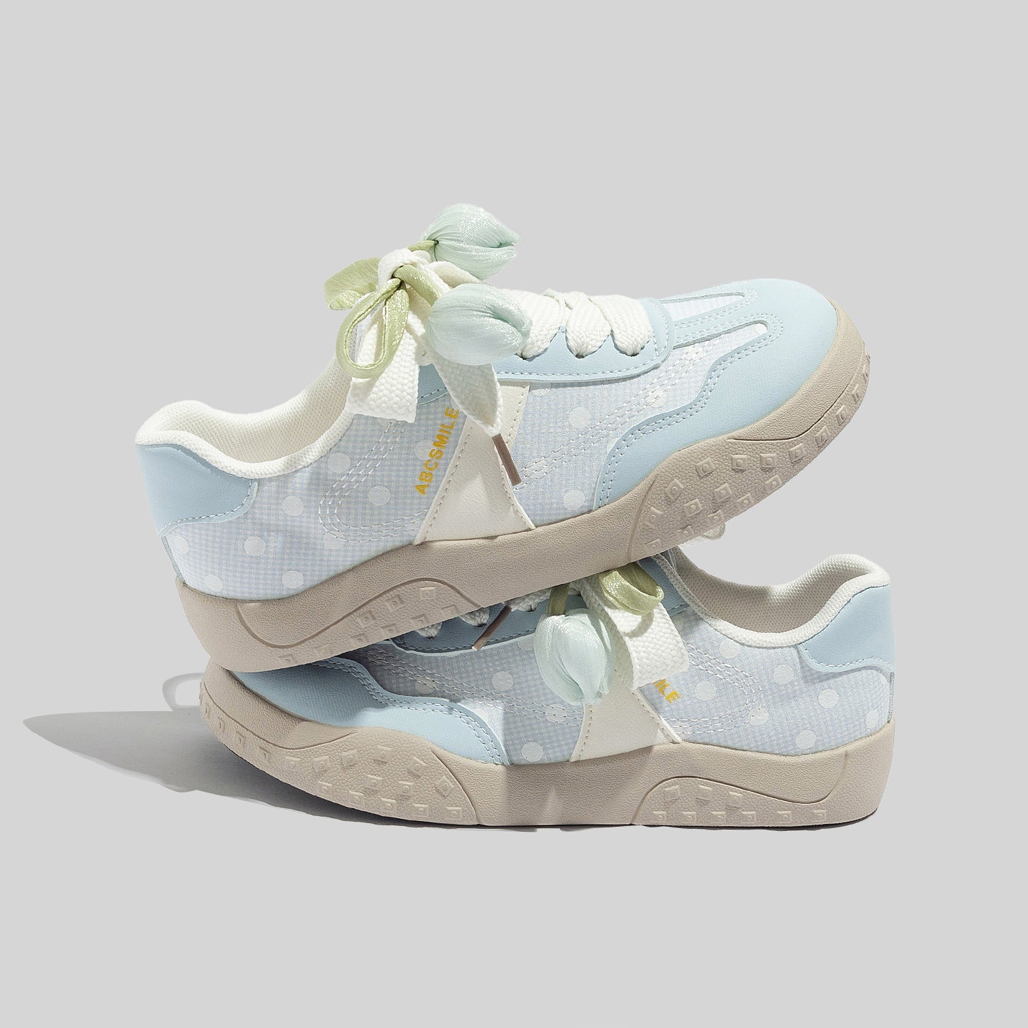 Damen Freizeit Sneakers mit leichtem Punktemuster und verspielten Schleifen
