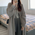 Damen Gemütliche Strickjacke mit oversized Schnitt und sanften Puffärmeln