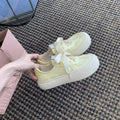 Damen Sneaker mit dekorativen Schleifen und hochwertiger Oberflächenstruktur