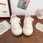 Damen Sneaker mit floralen Applikationen