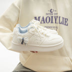 Damen Sneakers mit verspieltem Schleifenmotiv und schöner Applikation