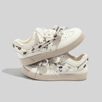 Damen Sneakers mit floralem Druck und innovativem Schnürsystem