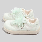 Damen Sneakers mit verspieltem Bogen-Design und atmungsaktiven Netzpanelen