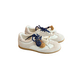 Damen bequeme Sneakers mit dekorativen Quasten und Schnürung R&B