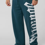 Herren nan weite Sweathose aus angerautem Fleece mit seitlichem Vintage-Print und Kordelbund R&B
