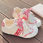 Damen Sneakers mit verspieltem Karomuster und dekorativen Schleifen